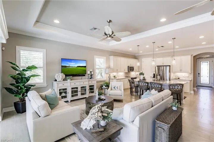 GREAT VIEW OF JUST HOW OPEN THIS FLOOR PLAN IS. PLUS BEAUTIFUL TILE FLOORING, MODERN LIGHTING & CEILING FANS!