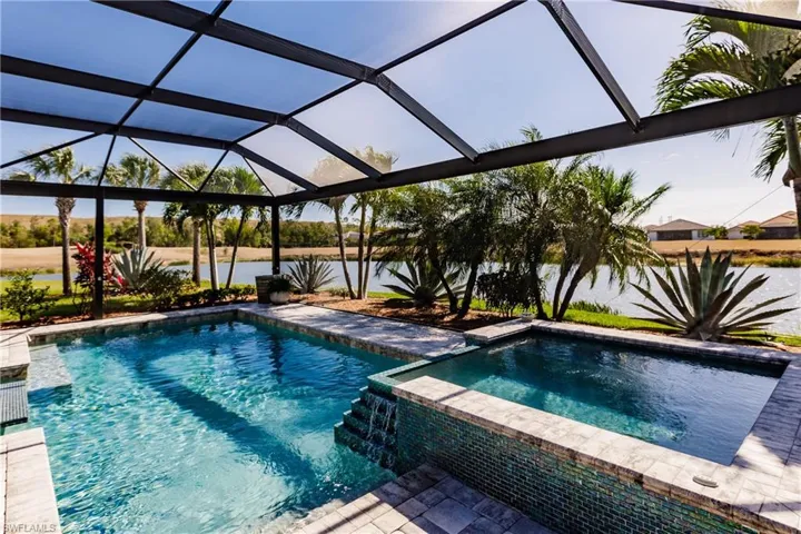 SIMPLY AMAZING VIEW! TIME TO CALL THE GRANDKIDS & GO FISHING RIGHT OUTSIDE OF YOUR VERY OWN LANAI. POOL & FISHING! THEY'RE READY! CALL NOW & BOOK YOUR VIEWING OF THE MOST BEAUTIFUL HOME IN PELICAN PRESERVE!