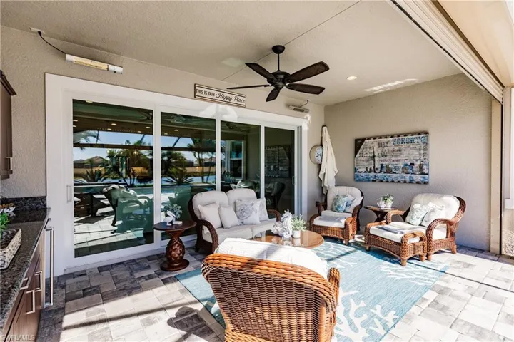FOUR STACKABLE IMPACT SLIDER DOORS TO OPEN UP TO ENTERTAIN. NOTE THE ELECTRIC HEATERS INSTALLED ABOVE THE DOORS! YES! THIS HOME HAS IT ALL.