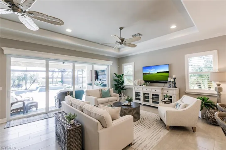 IMPACT WINDOWS & DOORS! TIME TO CALL FAMILY & FRIENDS! YOU CAN ENTERTAIN ALL THE WAY FROM THE KITCHEN, THRU THE LIVING ROOM TO THE LANAI & TO YOUR AMAZING POOL & SPA!