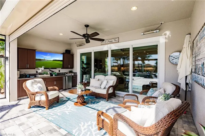 OUTDOOR SPACE 20 x 11 WITH LOWER & UPPER OUTDOOR RATED CABINETS W/ UNDER CABINET LIGHTING, BAR FRIDGE & SINK! IT IS EVEN MORE AMAZING IN PERSON!