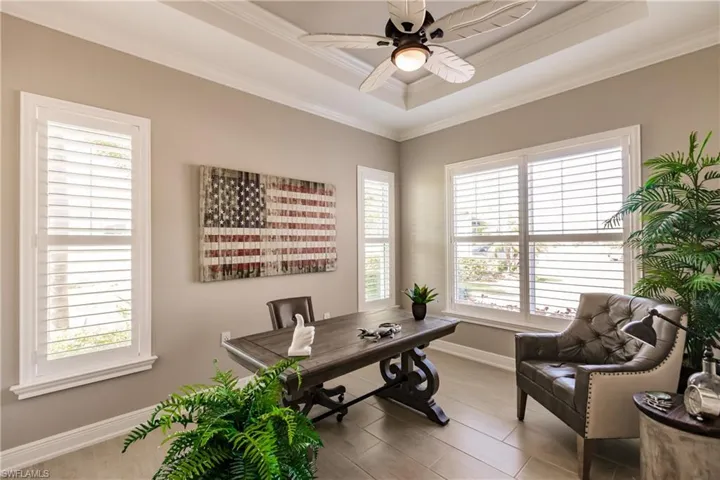 GUEST BEDROOM #3 IS SET-UP AS AN OFFICE! CHECK-OUT THE DETAIL OF THE FLOORING, PLANTATION SHUTTERS WITH TRIM & THE COFFERED CEILING & MODERN FAN! IT IS STUNNING!