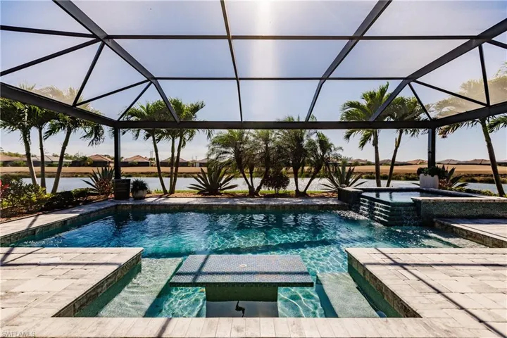 THIS IS PARADISE! POOL & SPA WITH A PICTURE WINDOW VIEW OF THE LAKE & GOLF COURSE. THE POOL EVEN HAS AN UMBRELLA AREA IN THE FOREGROUND!