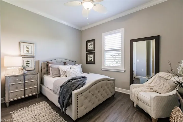 GUEST BEDROOM #1. BEAUTIFUL FLOORING, TRIM & READY FOR THE FAMILY TO COME & VISIT!