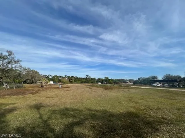 View of yard with a rural view