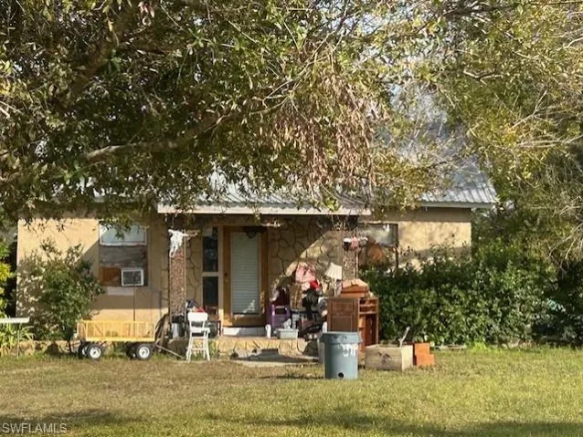 View of front of house with a front yard