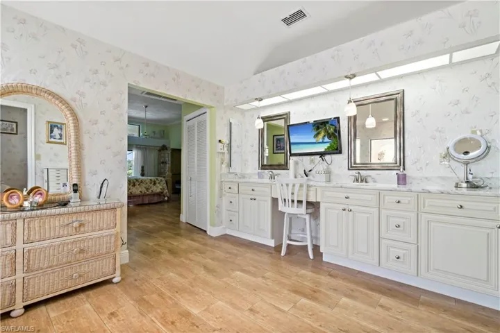 Bathroom featuring vanity and hardwood / wood-style floors