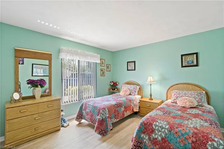 Bedroom with light hardwood / wood-style flooring