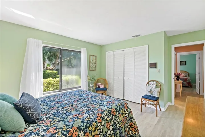 Bedroom featuring a closet and light wood-type flooring