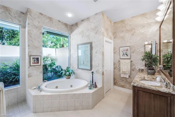 Large jetted Jacuzzi and private water closet