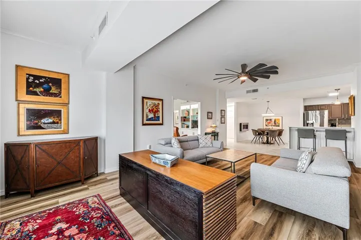 Living room featuring hardwood / wood-style flooring and ceiling fan
