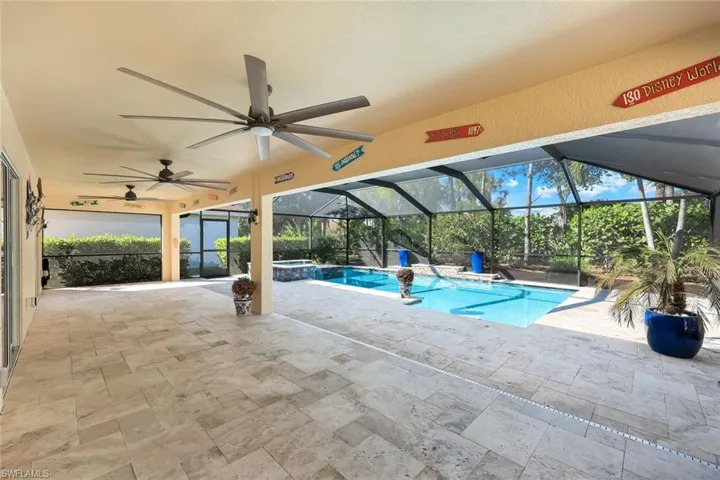 View of swimming pool with a patio, ceiling fan, a lanai, and a sunroom
