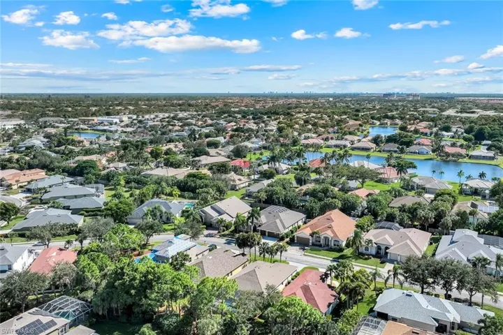 View of property location with nearby suburban area and a nearby body of water