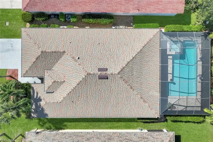Aerial view, new shingle roof, screen enclosed pool