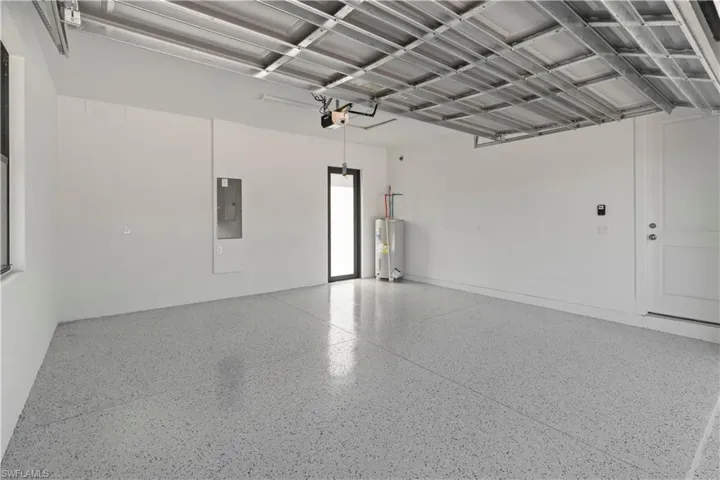 Garage with electric panel and water heater