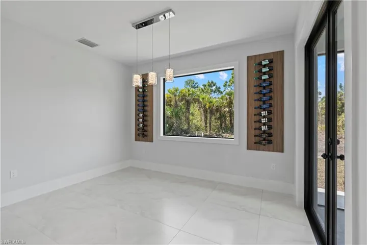 Unfurnished dining area featuring baseboards