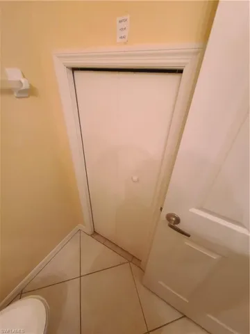Half bath under-the-stairwell storage