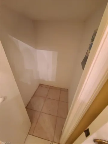 Half bath under-the-stairwell storage