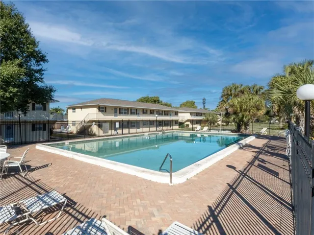 Community pool with a patio area