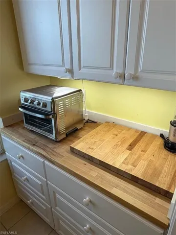 Kitchen view of white cabinets