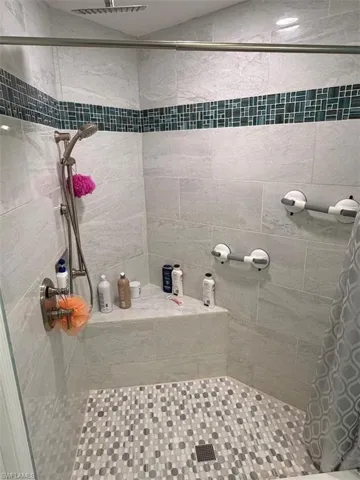Full bathroom with a shower stall