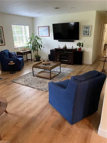 Living room with light wood-type flooring