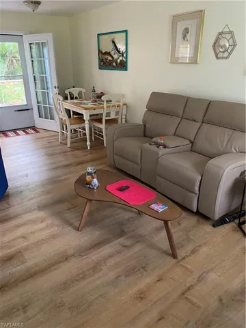 Living room with light hardwood / wood-style flooring