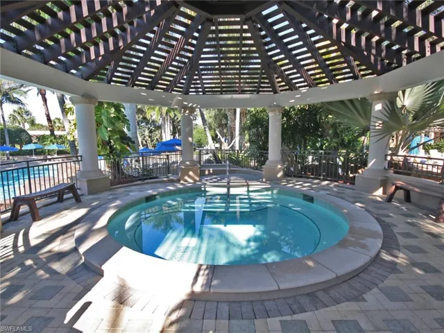 View of swimming pool with a patio area, a pergola, a pool, and a community hot tub