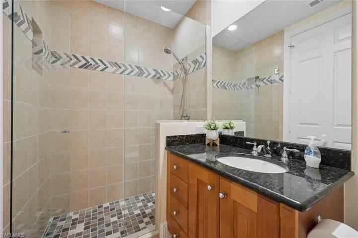 Bathroom 3 with vanity and tiled shower