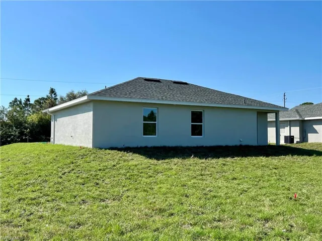View of home's exterior with a lawn