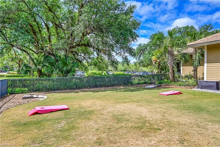 Community Pool play yard with Corn Hole and Tether Ball