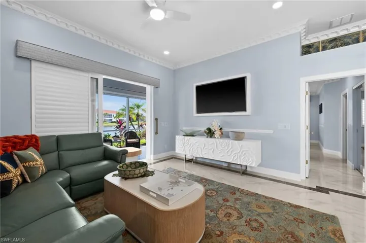 Living room featuring ceiling fan