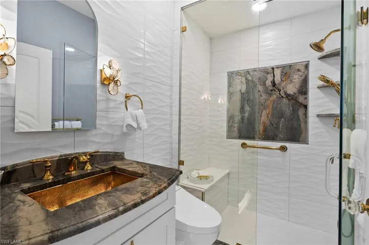 GOLD SINK!! 2nd Bathroom featuring walk in shower, vanity.