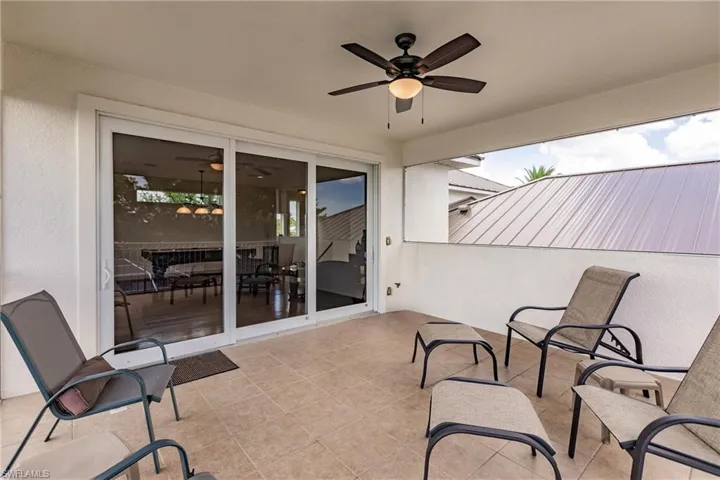 View of patio featuring ceiling fan