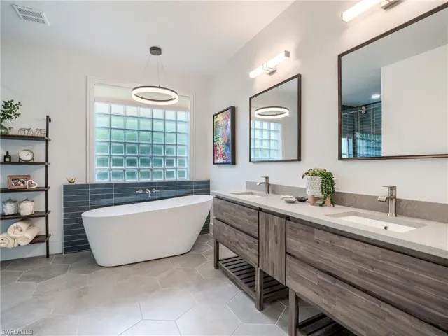 Thoughtfully designed primary bath to be open an uncluttered