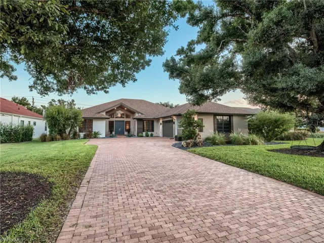 A wide, oversized driveway crafted with pavers
