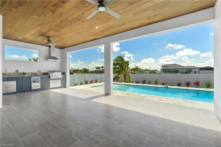 Step outside to your PRIVATE BACKYARD OASIS, complete with an oversized rectangular pool, lush landscaping, and serene surroundings.