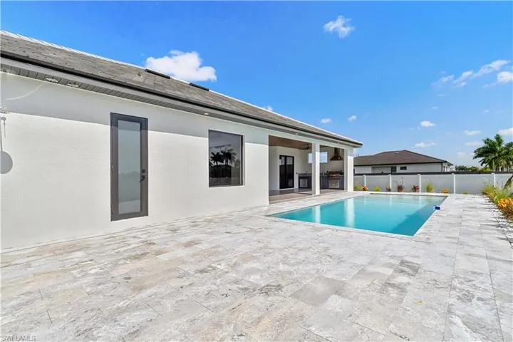 A convenient cabana half bathroom provides easy pool access, enhancing comfort for outdoor entertaining and poolside use.