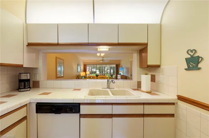 Kitchen with pass-thru access to larger dining area