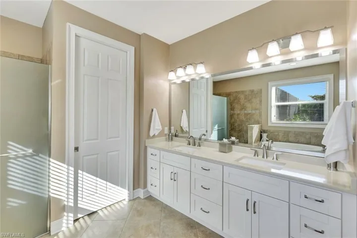 Master Bathroom featuring vanity and tile patterned flooring