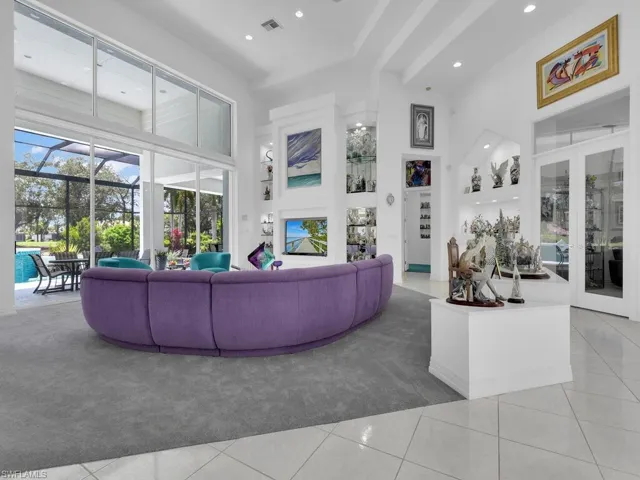 Great Room w/ pocketing sliders and custom lighting