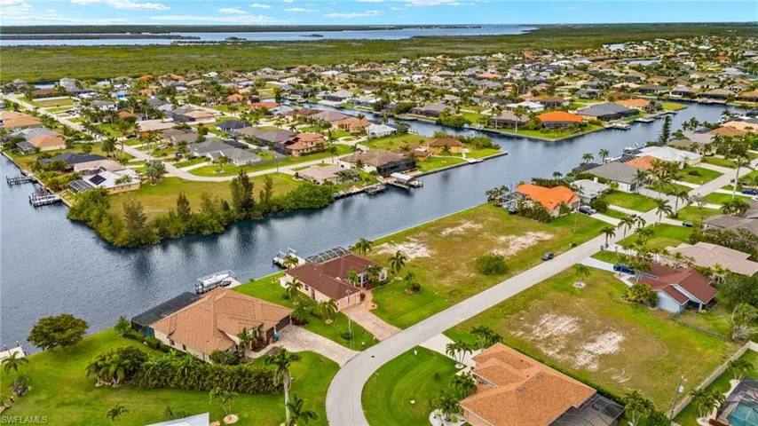 Aerial view of residential area with a nearby body of water