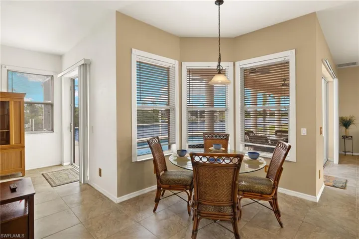 Dining area featuring baseboards and light tile patterned flooring