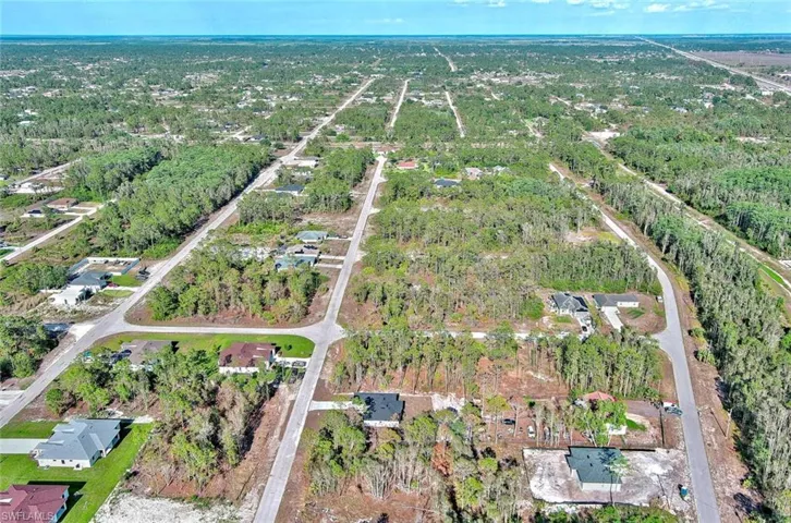 View of property location with nearby suburban area