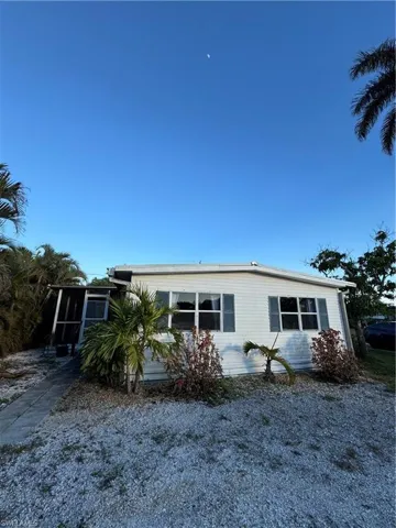 Front of house with a sunroom