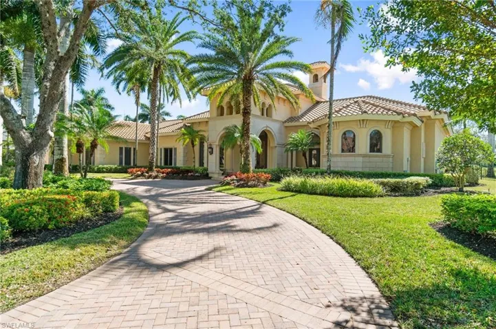 Mediterranean / spanish-style house with a front lawn
