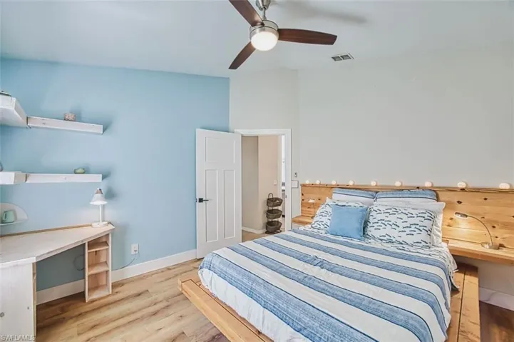 Bedroom with light wood-type flooring and ceiling fan