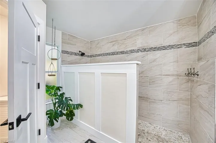 Full bathroom featuring a walk in shower