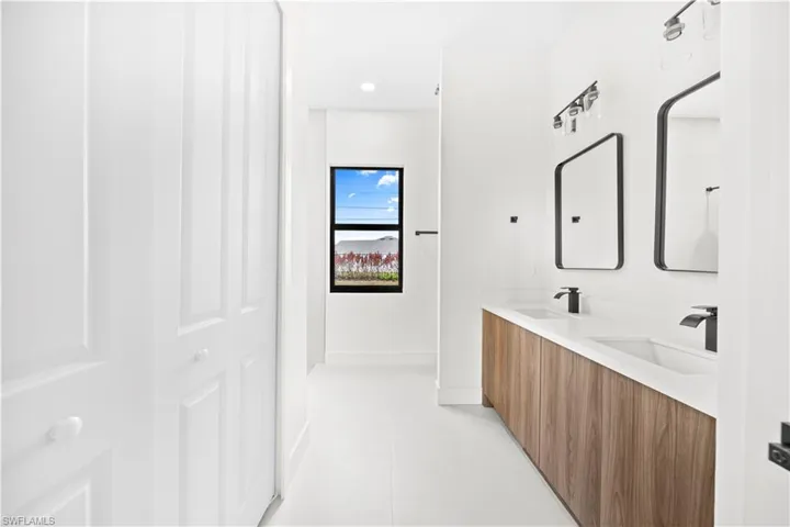 Full bath with double vanity and recessed lighting