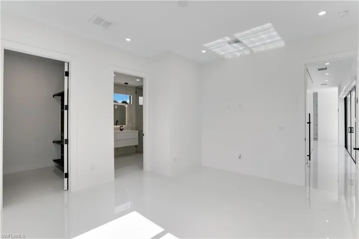 Unfurnished room featuring visible vents and recessed lighting